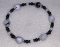 Bracelet: Moonstone with Black Tourmaline inclusions, hematite, and obsidian