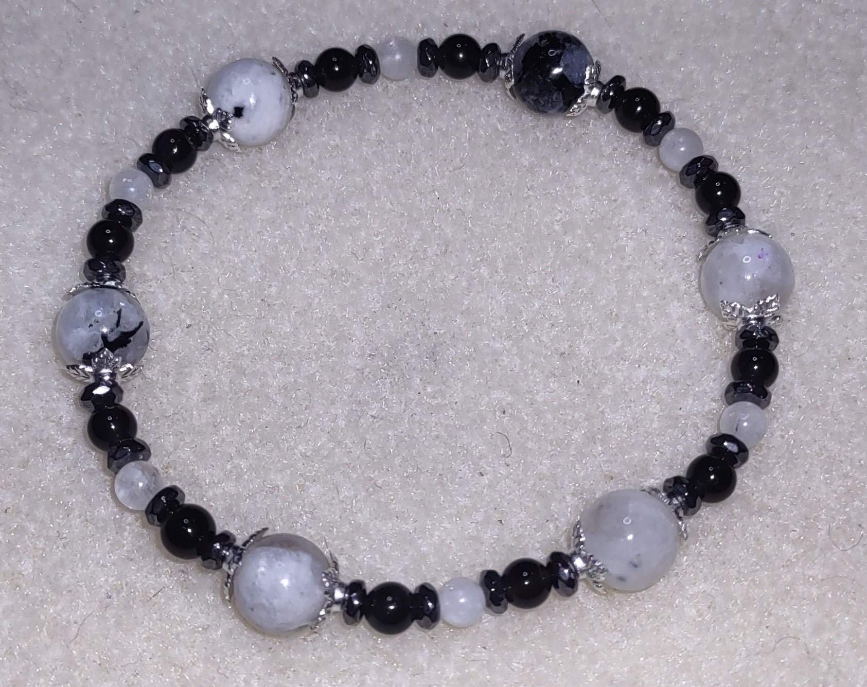 Bracelet: Moonstone with Black Tourmaline inclusions, hematite, and obsidian