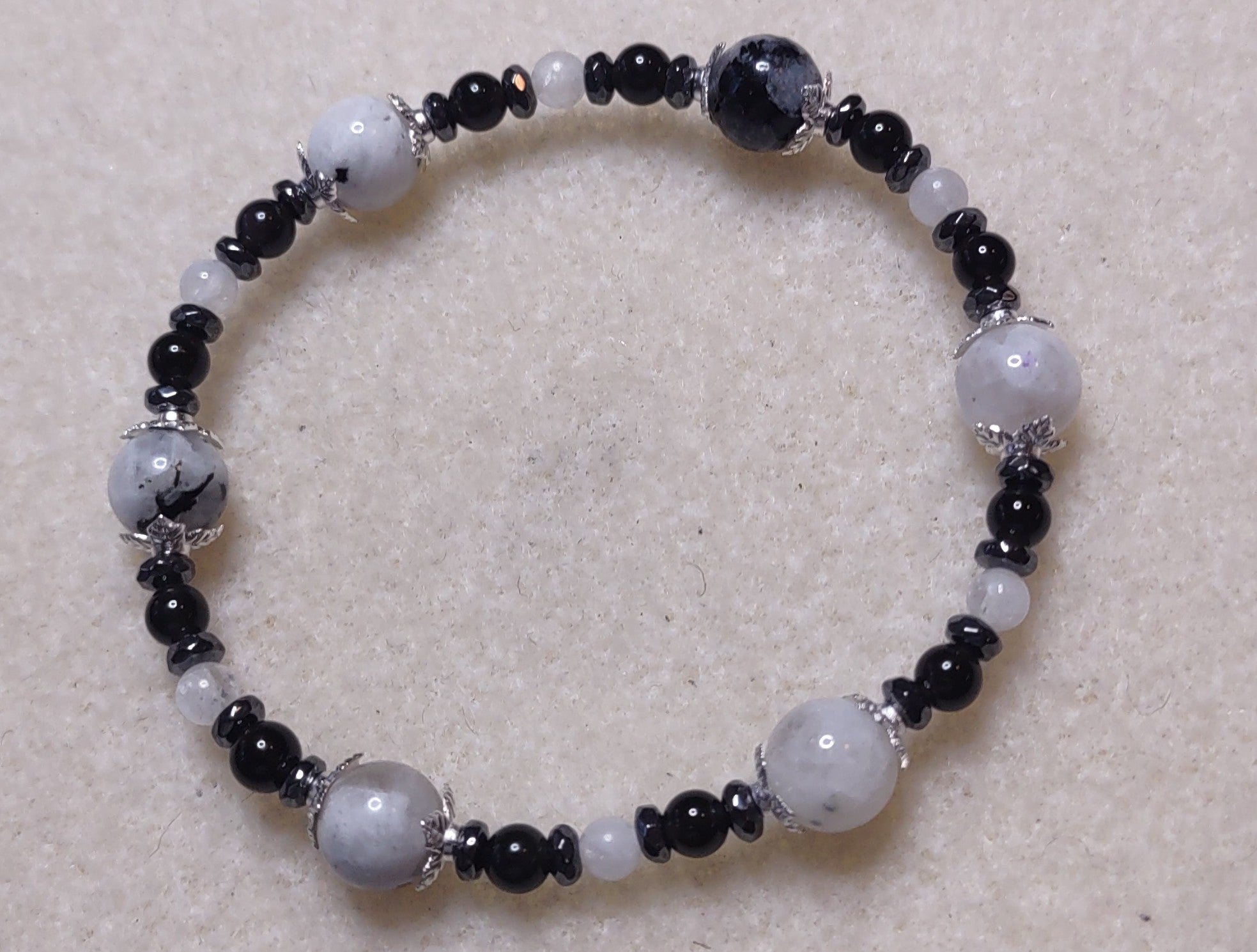 Bracelet: Moonstone with Black Tourmaline inclusions, hematite, and obsidian